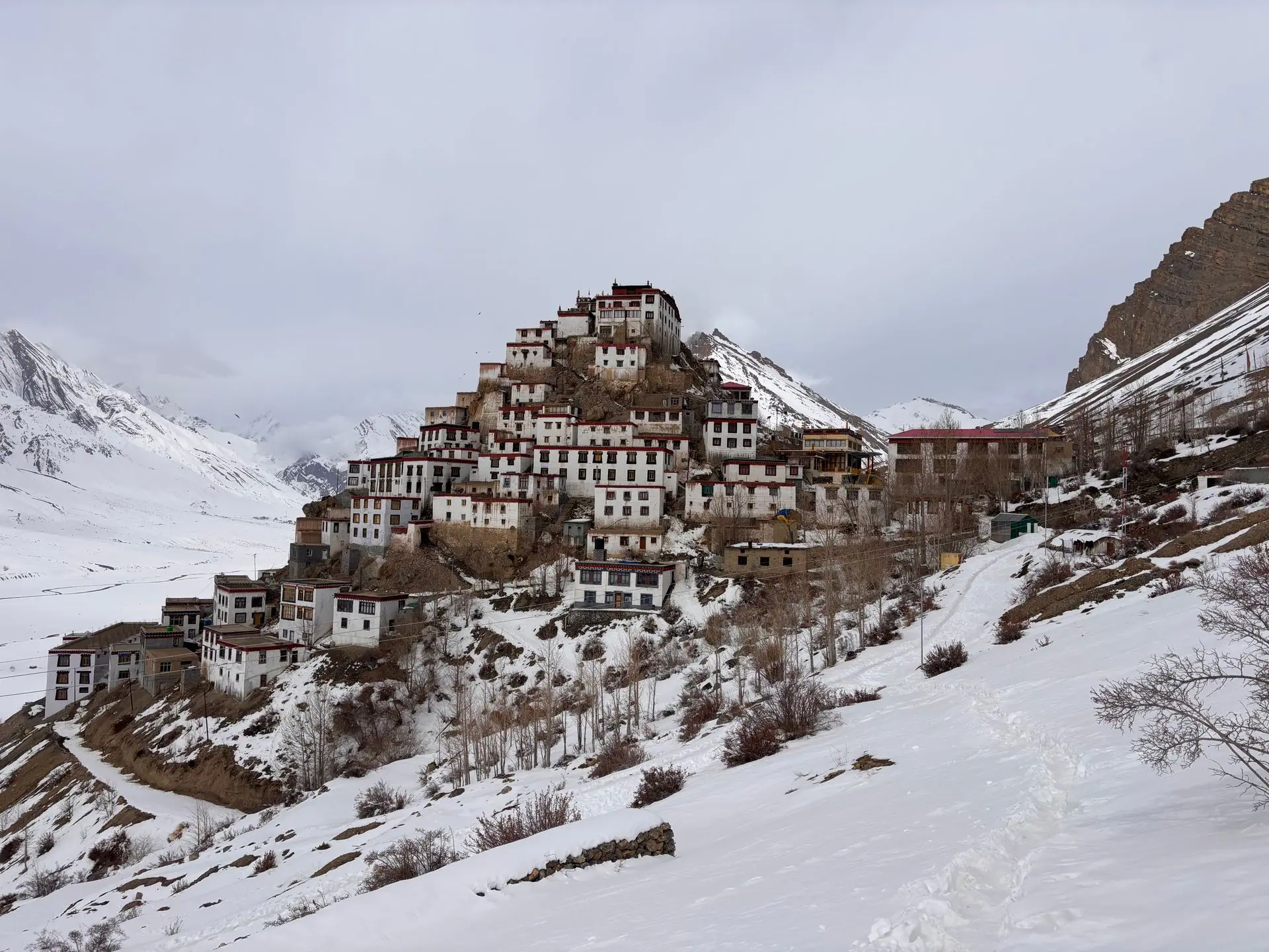 A picturesque monastery nestled in the snowy mountains of Spiti Valley, Himachal Pradesh