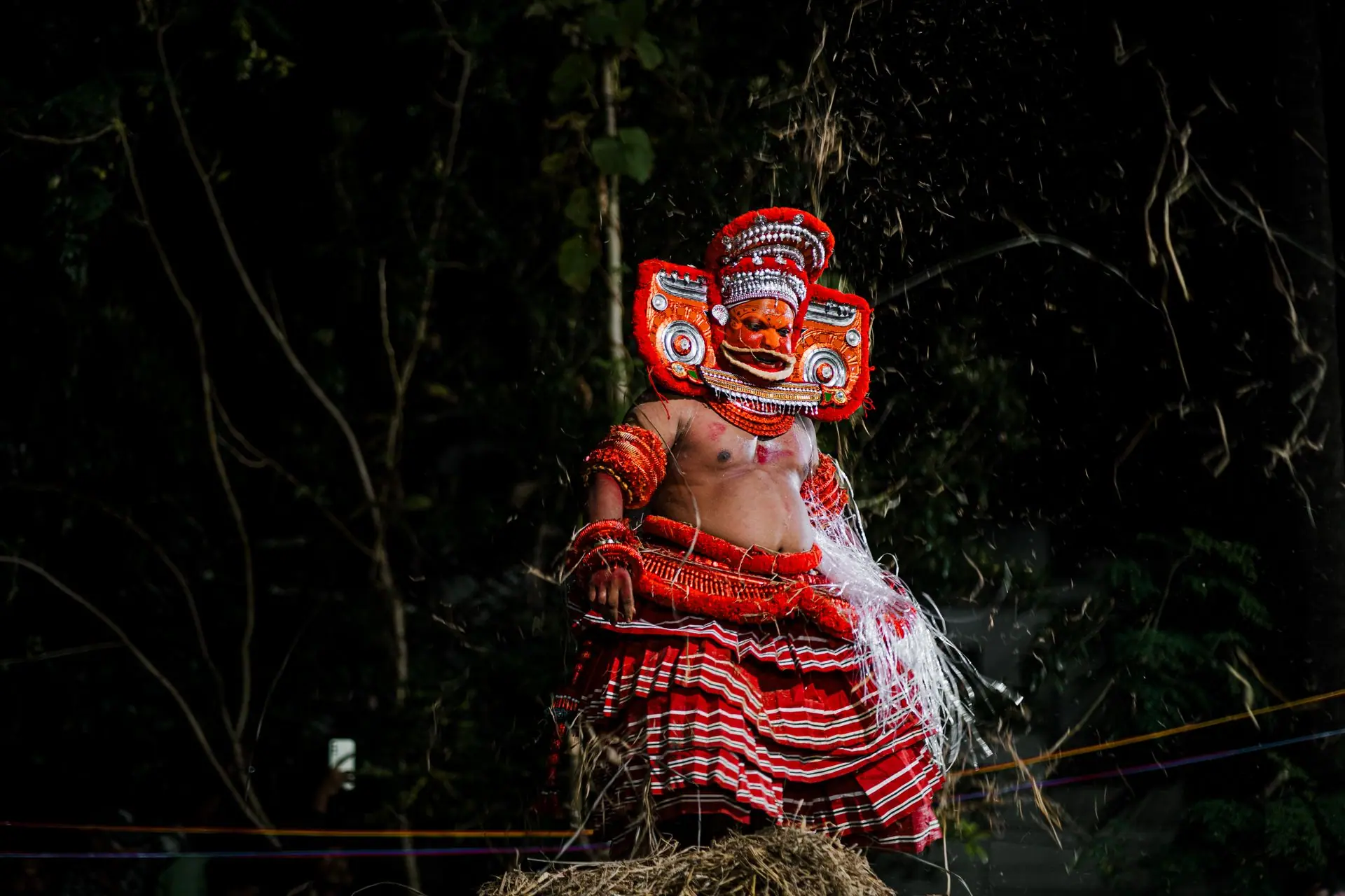 Captivating image of a Theyyam performer in traditional costume, Kannur, Kerala