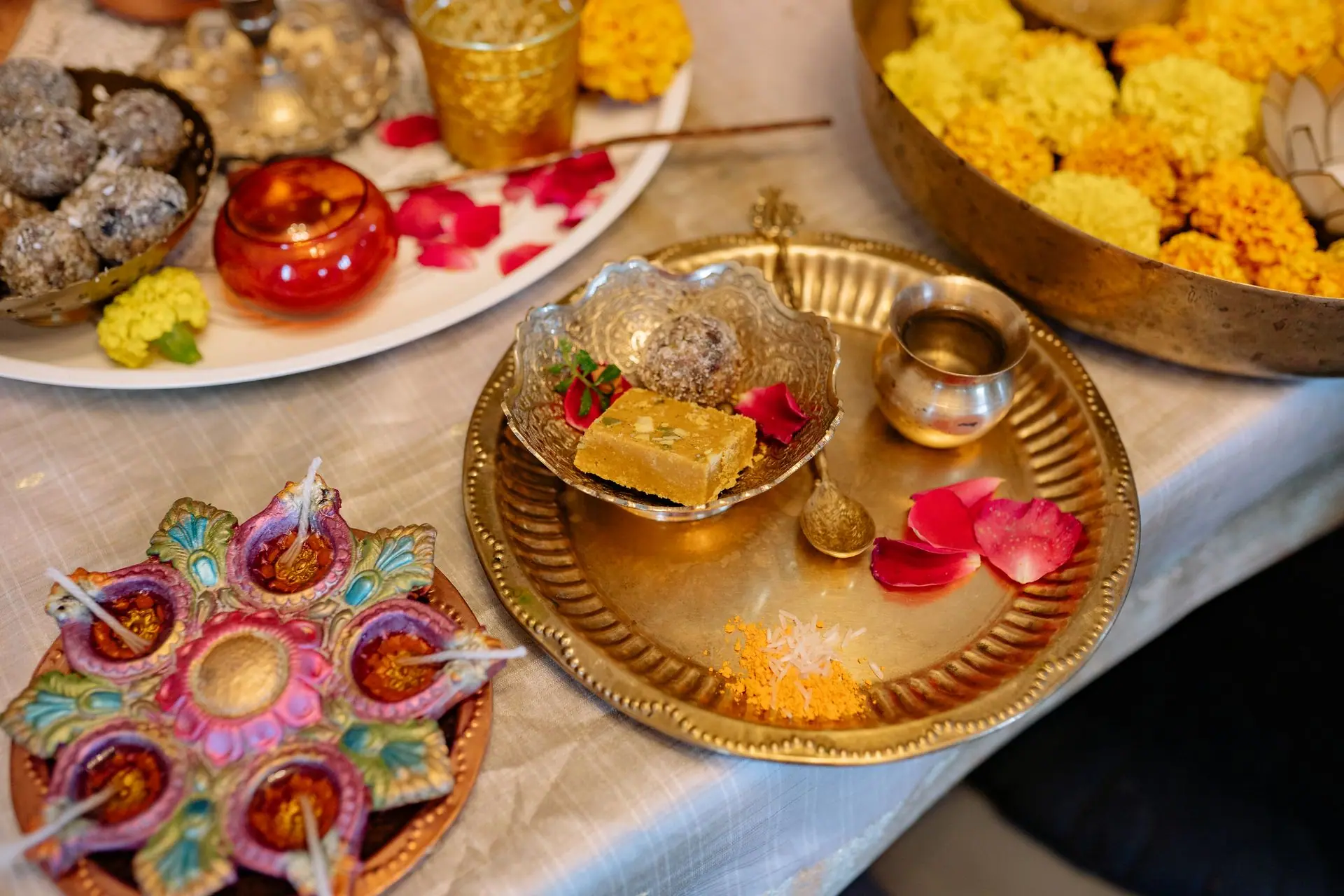 A vibrant display of Indian sweets and decorations for Diwali festival, showcasing traditional culture and festivity